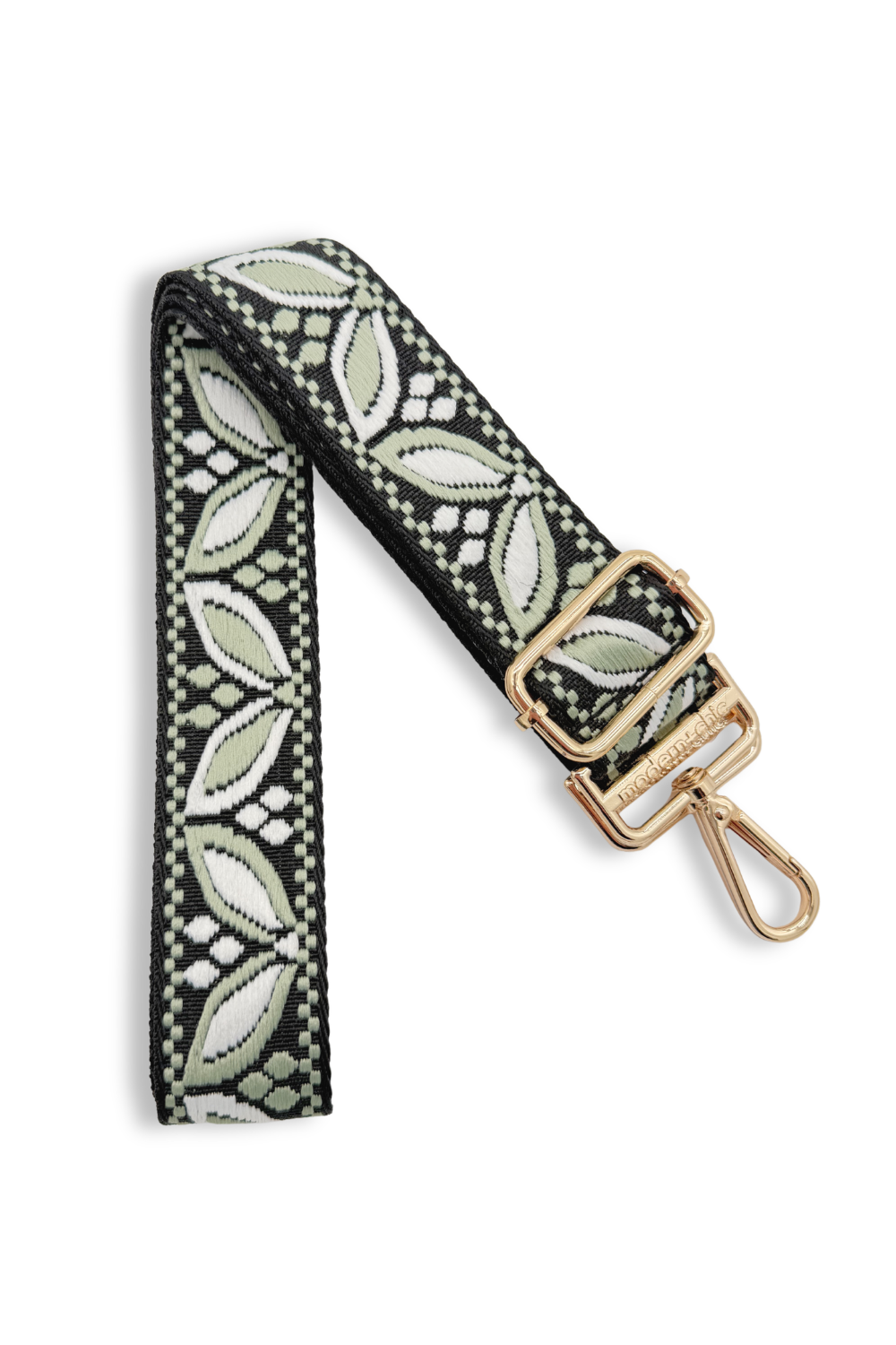 Patterned green sage colored strap with a gold clasp on a white background