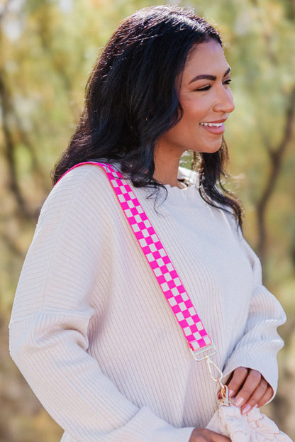 Woman wearing a hot pink and white Drury Road Lizzie Adjustable purse strap for crossbody bags over her shoulder. 