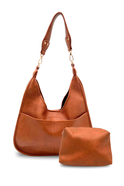 A camel Drury Road Clara Vegan Leather Slouchy Tote Bag for Women with coordinating removable zipper pouch on a white background. 