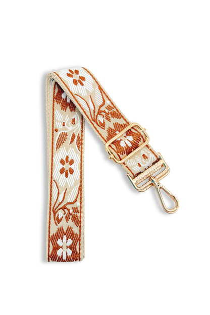 Camel floral embroidery strap with a gold buckle on a white background