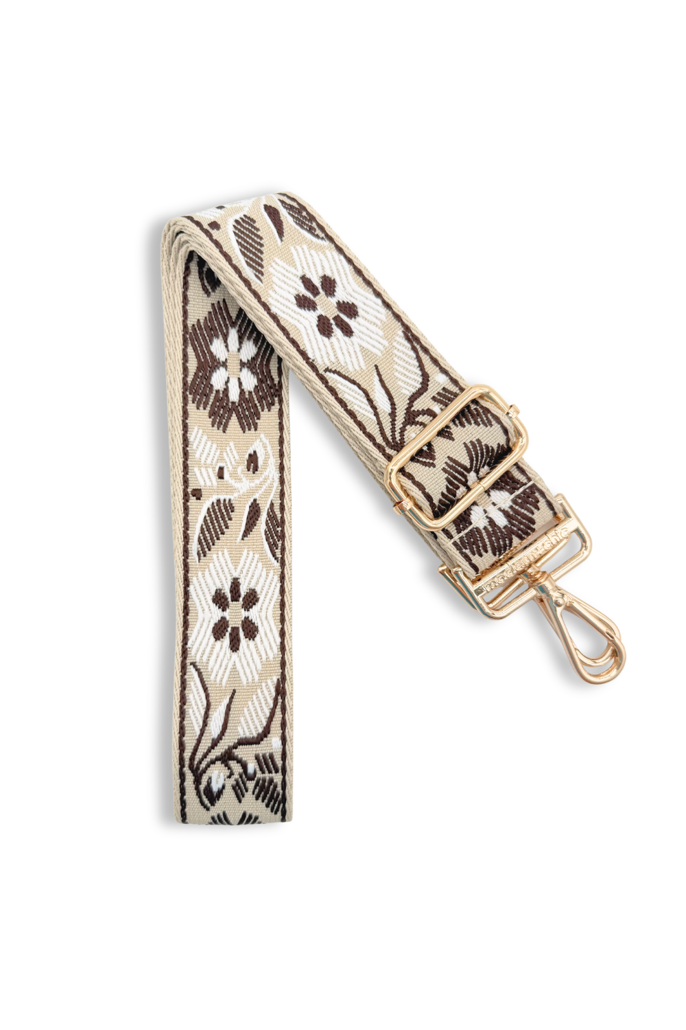 Coffee colored bag strap with a floral pattern on a white background