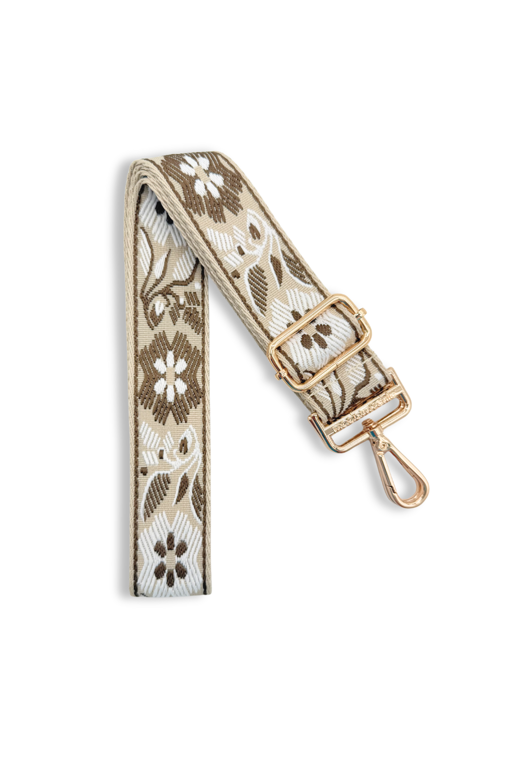 Dark taupe colored bag strap with floral patterns on a white background