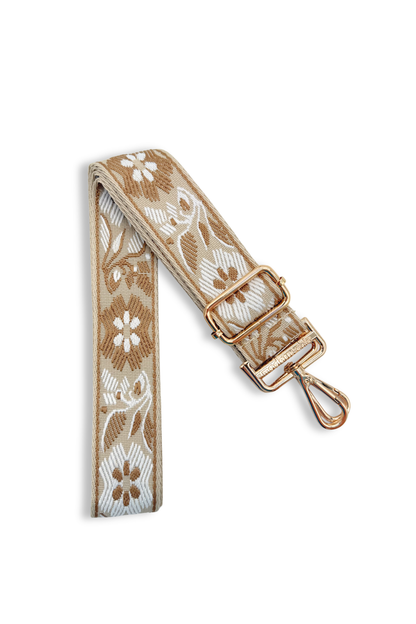 Fawn floral embroidered strap with a gold buckle on a white background