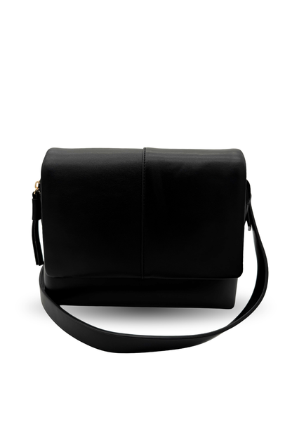 Black handbag with a strap on a white background