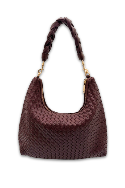 Red plum colored woven handbag with braided handle on a white background