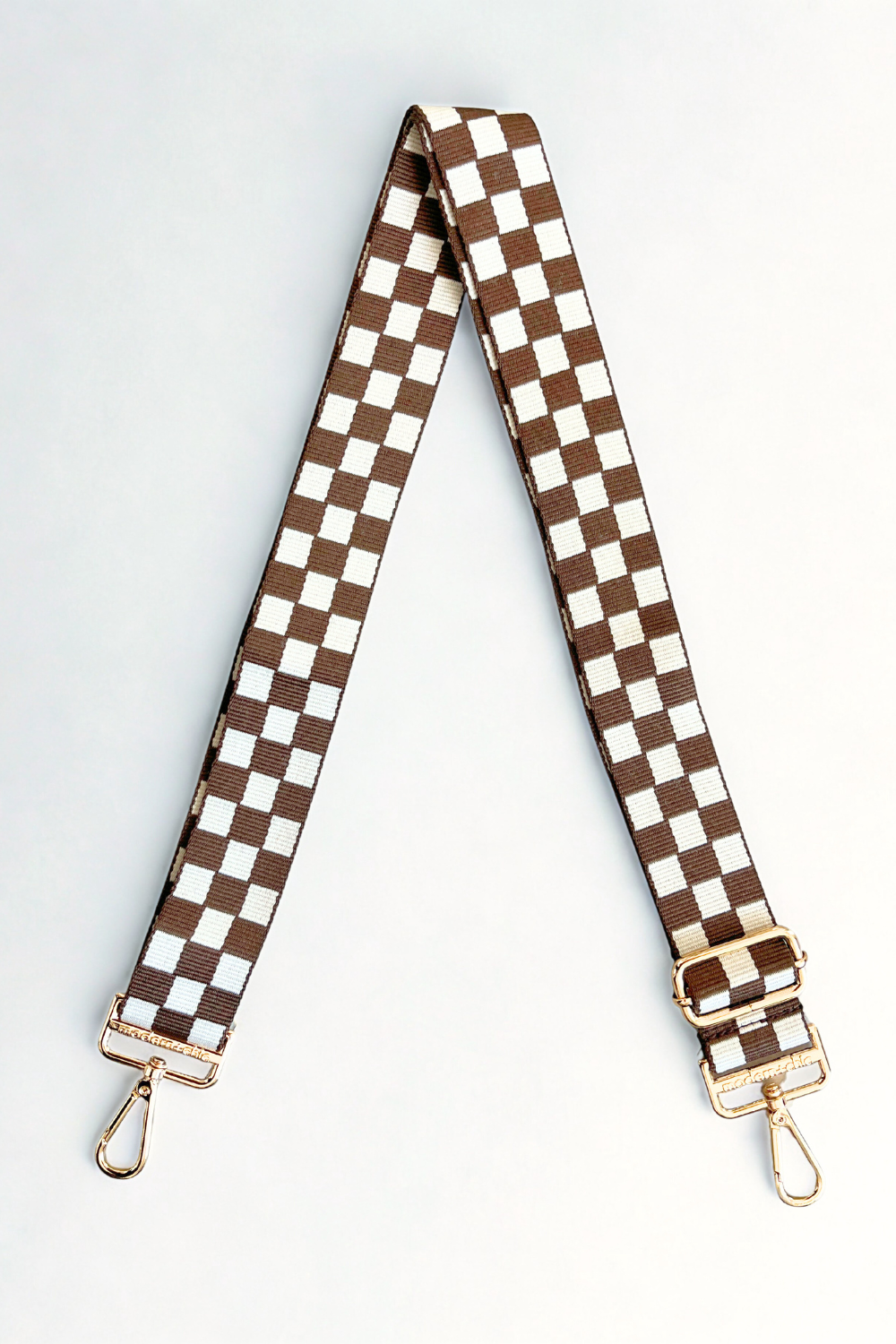 Brown and white Drury Road Lizzie Checkered Purse Strap for Crossbody Bags on a white background.