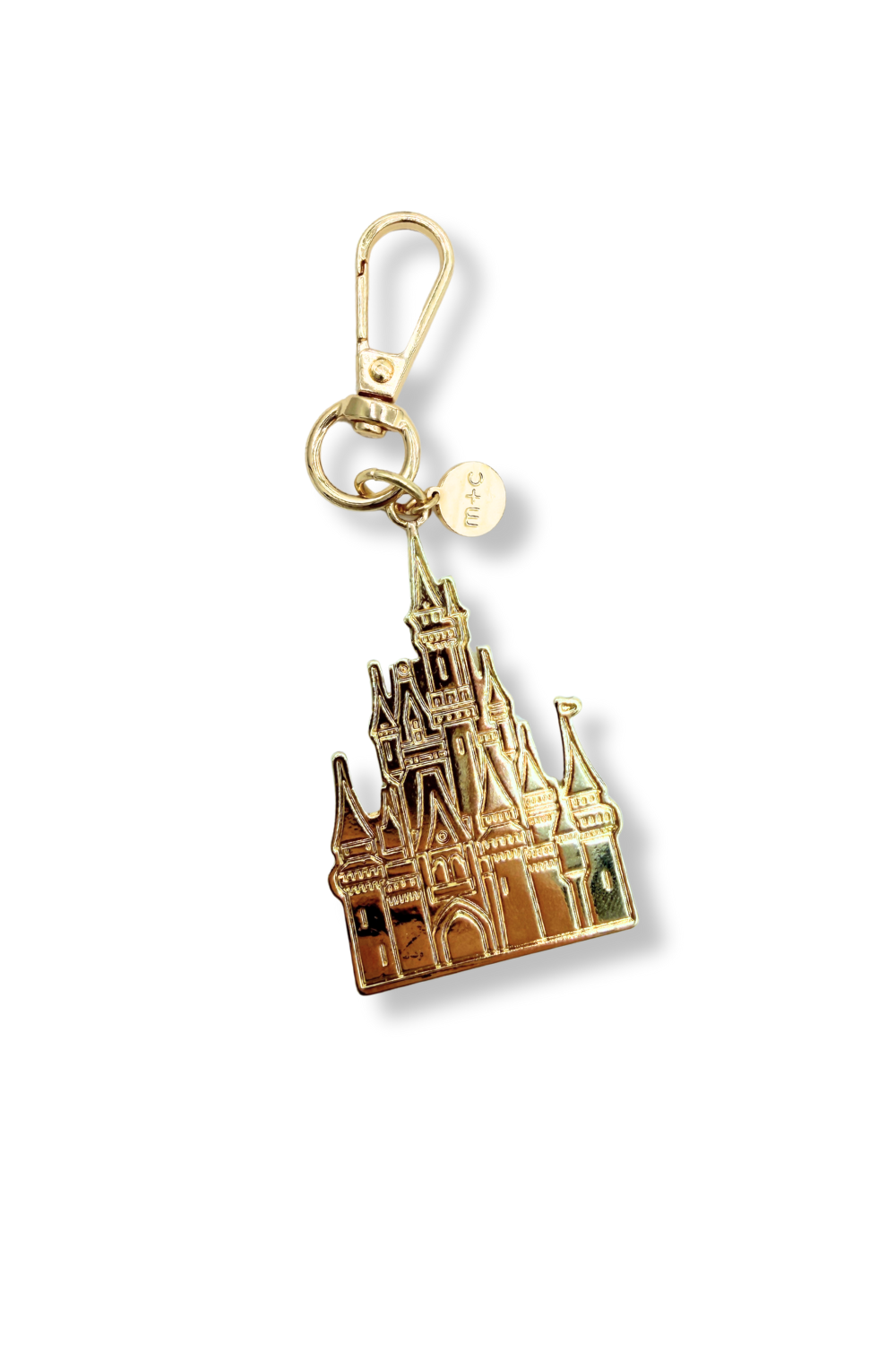 Drury Road Palace Charm – Gold castle-shaped keychain on a white background. 