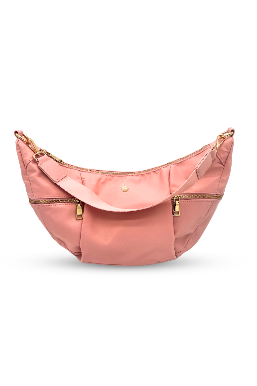 Pink Drury Road Parker Crescent Crossbody Bag for Women on a white background.