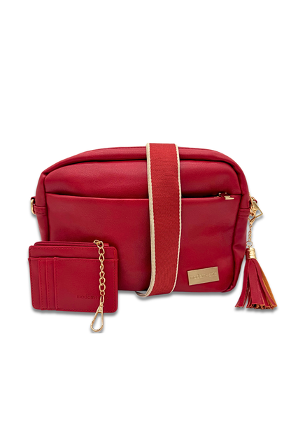 Red handbag with matching wallet on a white background
