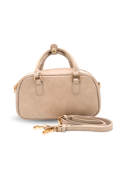 A cream Drury Road Remi Vegan Leather Crossbody Purse with gold hardware on white background. 
