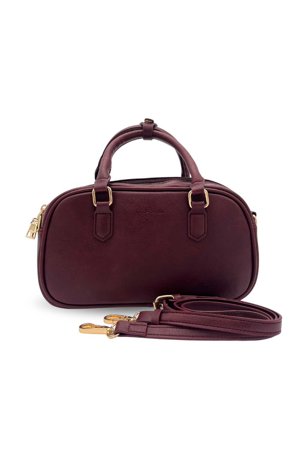 A wine Drury Road Remi Vegan Leather Crossbody Purse with gold hardware on white background. 
