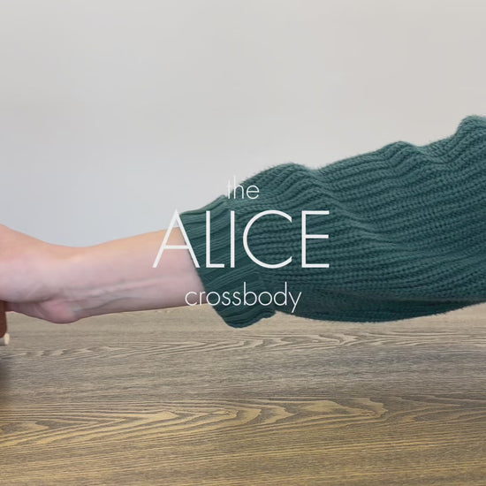 A video displaying all the features and benefits of a coffee colored Alice Crossbody vegan leather bag with gold hardware, included key leash, matching wallet and removable tassel. 