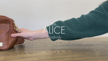 A video displaying all the features and benefits of a coffee colored Alice Crossbody vegan leather bag with gold hardware, included key leash, matching wallet and removable tassel. 