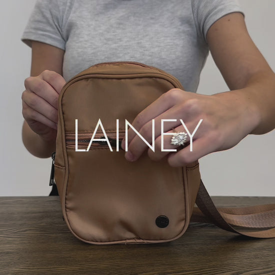 A video of a Woman showing the features and benefits of a Drury Road Lainey Convertible Crossbody Bag for Women. 
